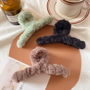 Plush hair claw clip for women, large autumn winter furry shark clip for hair buns.