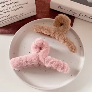 Fluffy plush hair claw clips for women, large autumn and winter hair accessories in pink and brown.