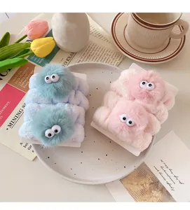 Detailed view of cute plush wristbands with googly eyes, perfect for face washing and sports.