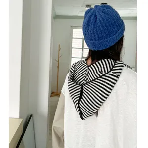 Women winter blue knitted beanie and black white striped hooded scarf warm all-in-one hat.