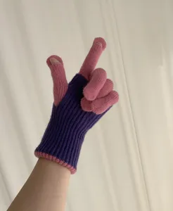 Detailed view of the knit gloves showing the purple cuff, pink fingers, and fingertip slit design.