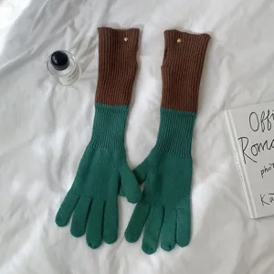 Long color-blocked knit gloves for women and men, warm winter outdoor cycling gloves top view.