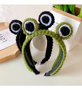Cute knit frog eye headband detail shot, soft wool green hair hoop for daily cute style.