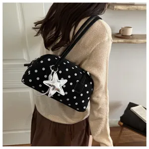 Black polka dot bowling bag for women, trendy chic shoulder bag with star charm.