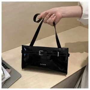 Black patent leather underarm bag for women, chic stylish shoulder handbag with buckle.
