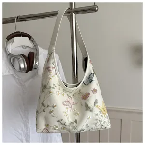 Bolso de hombro bordado elegante para mujer con diseño floral y mariposas para uso diario.