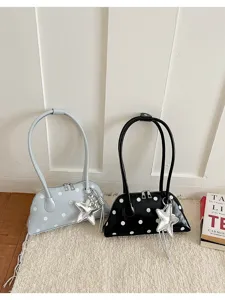 Fashionable polka dot shell shoulder bag for women, shiny patent leather underarm bag with star charm.