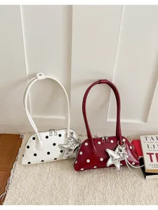Stylish polka dot patent leather shoulder bag for women, trendy daily underarm shell handbag.