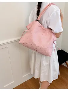 Pink star print tote bag detail view, large capacity shoulder handbag for women daily use.