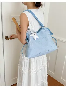 Light blue star print tote shoulder bag detail view, casual commuter bag for women daily use.