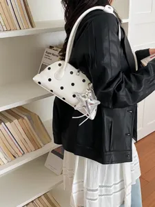 White polka dot shoulder bag for women, stylish shiny leather underarm purse with star charm.