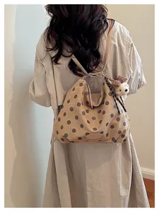 Korean style vintage polka dot suede tote bag detail view showcasing soft texture and cute bear.