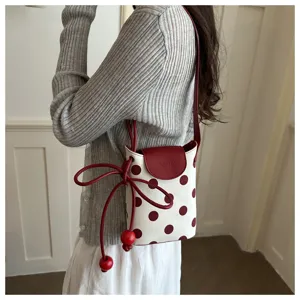 Borsa a tracolla alla moda a pois per donna, leggera e pratica per ogni occasione.