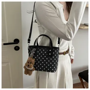 Schwarze Pünktchen Eimer Tasche mit Henkel und Schultergurt, stylische Damen Handtasche.