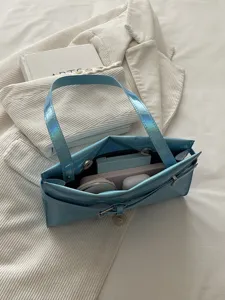Glossy holographic blue shoulder bag for women, stylish casual underarm handbag for autumn.