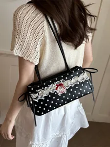 Chic black and white polka dot shoulder underarm bag for women, stylish daily fashion handbag.