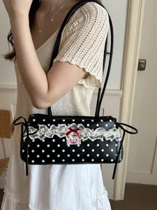Stylish women's polka dot shoulder bag with lace trim and bow, perfect for daily wear.