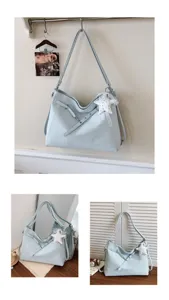 Chic light blue polka dot shoulder bag for women, stylish large capacity commuter tote.