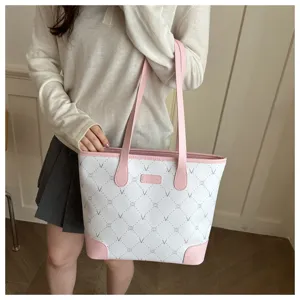 Spacious pink and white tote bag with elegant monogram design for women's daily commute.
