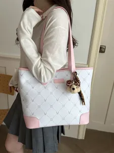 Chic large capacity tote bag with pink contrast trim and stylish print for women daily use.