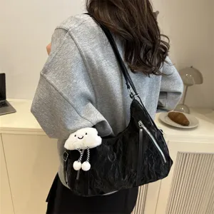 Casual black shoulder tote bag with cute cloud pendant, large capacity commuter bag.