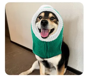 Cute pet knitted snood hat for dogs and cats, funny green and white costume hood detail.