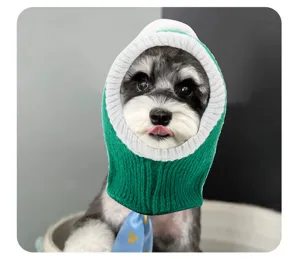 Pet knitted hat detail view, cute green and white dog costume hood for funny dress up