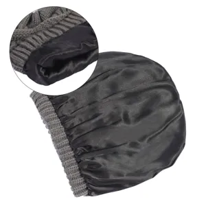 Grey knit winter beanie hat with smooth black satin lining, thermal windproof close-up view.