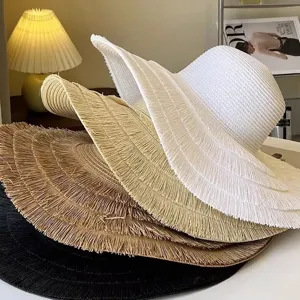 Stylish wide brim straw hat for women, foldable summer beach sun hat with UV protection.