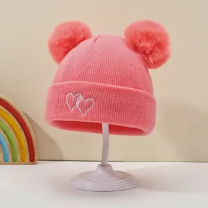 Pink baby knit beanie with double pom pomss and cute white heart embroidery warm winter hat.