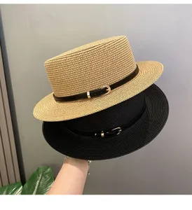 Detailed view of women's flat top straw hat with stylish belt buckle, perfect for beach summer.