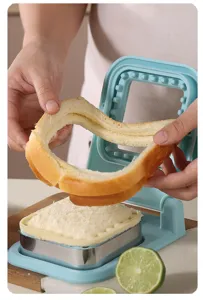 Closeup of sandwich cutter mold in use, showing clean crust trimming and sealing function.
