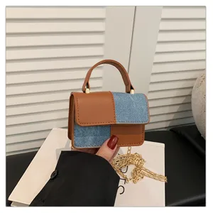 Stylish patchwork small square handbag with top handle and chain strap for summer commuting.