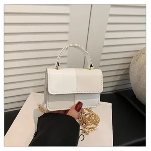 Chic white colorblock small square handbag with top handle and gold chain strap for daily use