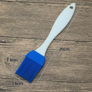 Silicone basting brush for barbecue and baking with white handle and blue head, length 20cm.