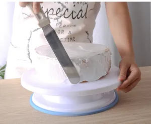 Cake decorating turntable detail shot showing smooth rotation for frosting cakes.