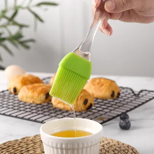 Large silicone pastry brush with crystal clear handle for baking, BBQ and kitchen cooking use.