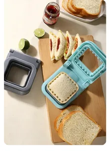 Square sandwich cutter and sealer tool detail showing bread pressing and delicious sandwich making.