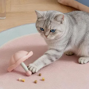 Interactive cat toy food dispenser, cute mushroom shape slow feeder puzzle for pets.