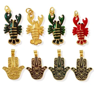Brass 18K gold plated lobster and hamsa hand enamel pendant charms for DIY jewelry making detail.