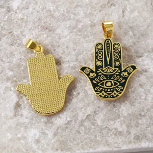 Hamsa hand pendant detail showing 18k gold plated brass and enamel design for DIY jewelry making.
