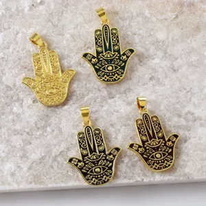 Detailed view of 18K gold plated brass Hamsa hand pendants with vibrant enamel in multi colors.