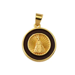 Detailed view of gold-plated brass round pendant with black enamel and religious figure relief.