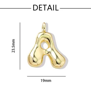 Gold puffy letter A pendant detail view, showing product dimensions and refined metal finish.