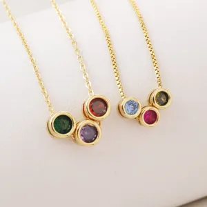 Detailed view of 18k gold plated multi-color cubic zirconia birthstone pendant necklaces.