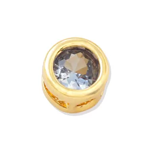 Close-up detail of 18k gold plated round DIY charm bead with sparkling cubic zirconia stone.