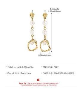 Detailed view of elegant gold irregular hoop earrings with baroque pearls and size specifications