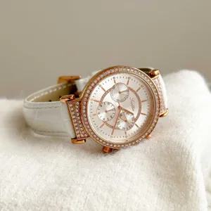Macro view of Scottie 9136 watch showing rhinestone bezel and crocodile leather strap