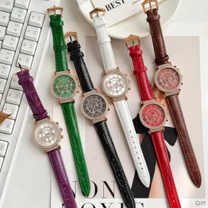 Close-up of Scottie quartz watches with rhinestone bezels and colorful croc straps.