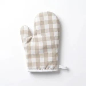 Close-up detail of beige and white gingham oven mitt with a fabric hanging loop